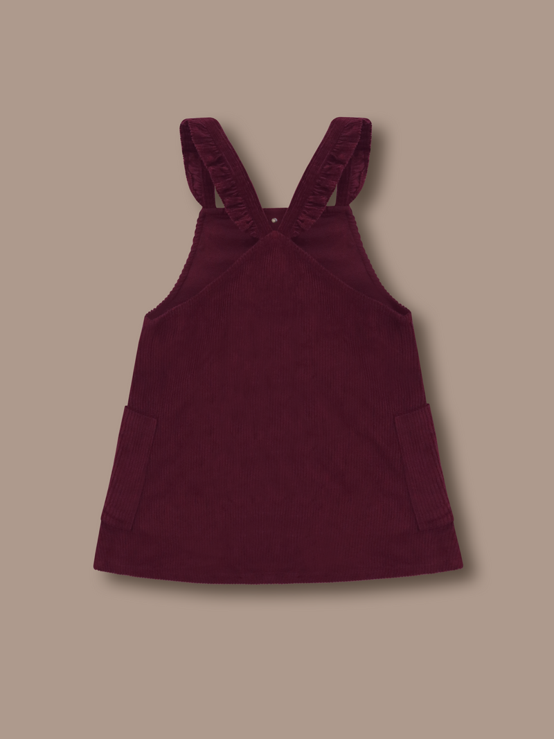 Add a splash of charm and comfort to your little girl's summer wardrobe with the Cherry Crumble Wine Dungaree Dress, thoughtfully crafted for style and play. Made from 100% breathable cotton.