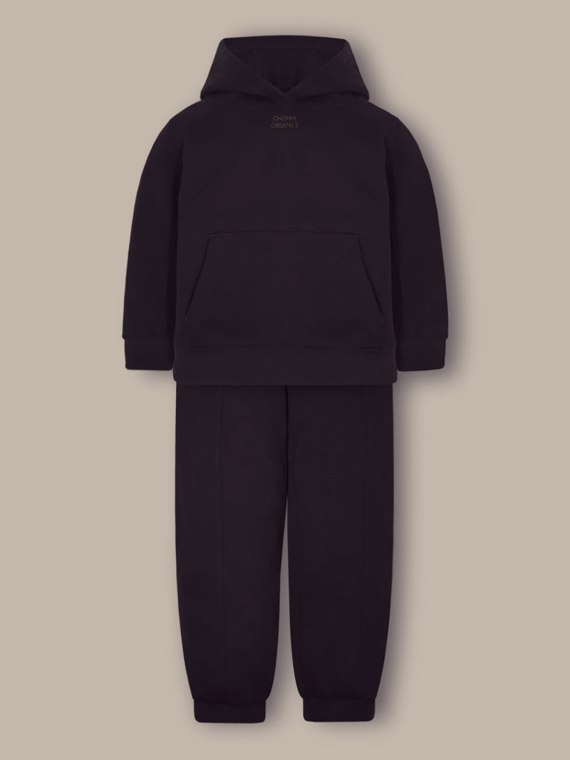 Embrace warmth and style this winter with the Cherry Crumble Dark Brown Solid Winter Sweatshirt Set, designed for unisex comfort and fashion. Made from 100% polyester