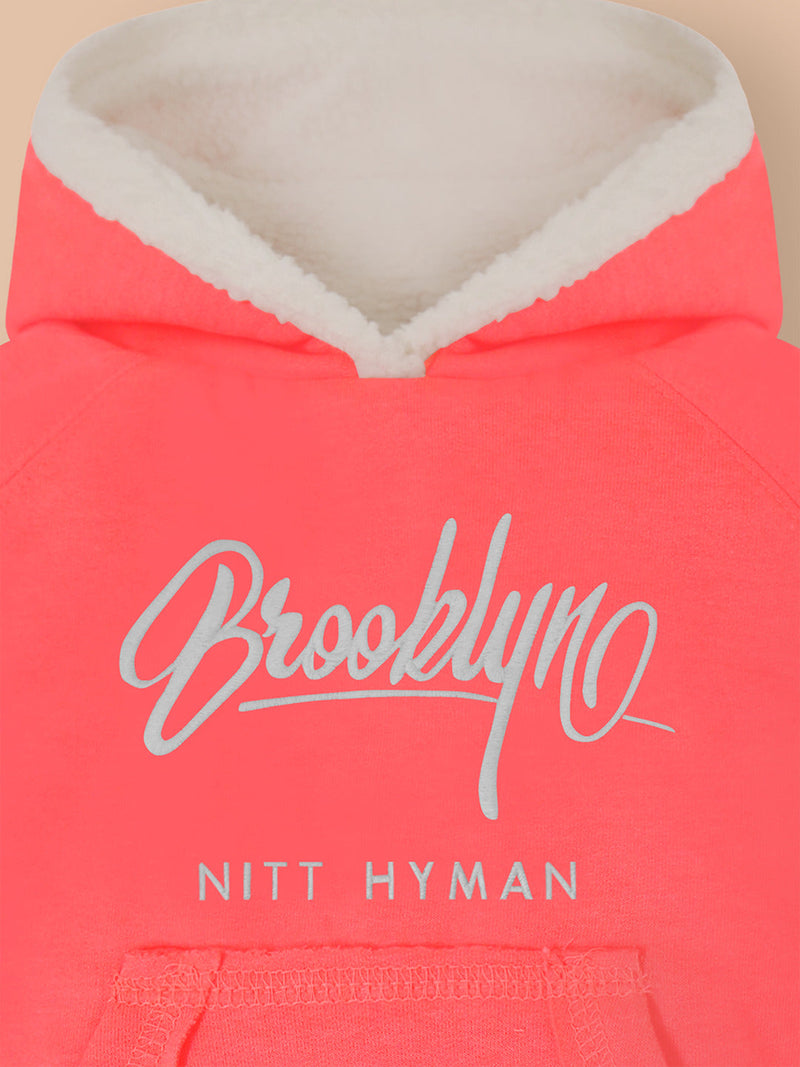 A Snug Sweatshirt To Keep You Warm This Season. This Urbane Sweatshirt Features A Cool Kangaroo Pocket, Metallic Icon At The Bottom & Ribbed Hems. The Soft Sherpa Lining Will Keep You Warm.